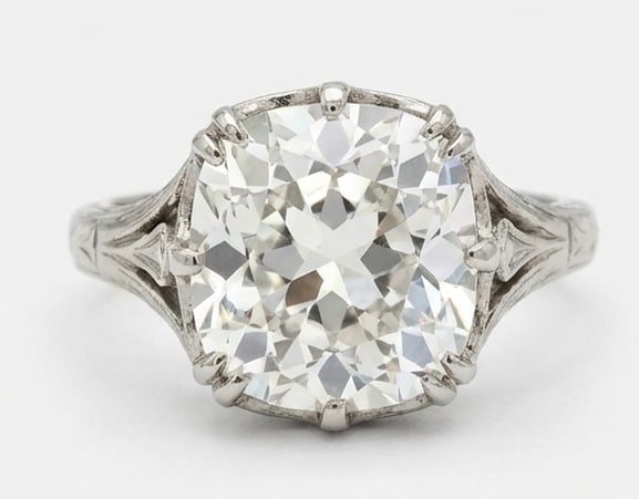 6.00 CT Lab grown diamond Lab-Grown Ring in White Gold: An exceptional 6.00 carat lab-grown lab grown diamond ring, expertly crafted in luxurious White Gold. The cushion cut solitaire set in a vintage-style basket with engraved band design highlights the b