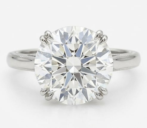 10.00 CT Lab grown diamond Lab-Grown Ring in White Gold: An exceptional 10.00 carat lab-grown lab grown diamond ring, expertly crafted in luxurious White Gold. The round brilliant cut solitaire set in a classic basket with subtle engraving design highlights