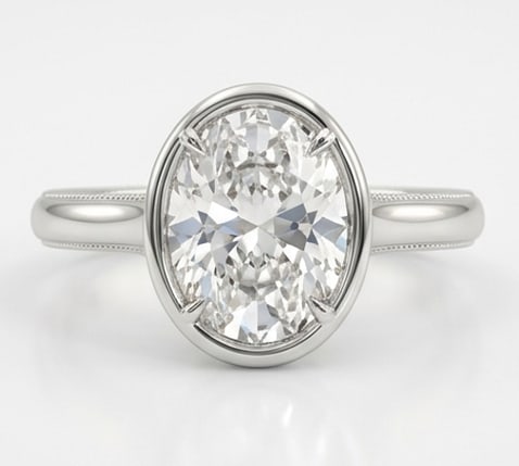 5.00 CT Lab grown diamond Lab-Grown Ring in White Gold: An exceptional 5.00 carat lab-grown lab grown diamond ring, expertly crafted in luxurious White Gold. The oval cut solitaire in a sleek bezel setting with fine milgrain detailing design highlights the