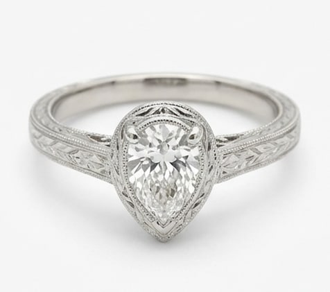 3.00 CT Lab grown diamond Lab-Grown Ring in White Gold: An exceptional 3.00 carat lab-grown lab grown diamond ring, expertly crafted in luxurious White Gold. The pear cut solitaire in a bezel setting with a vintage hand-engraved wheat pattern design highli