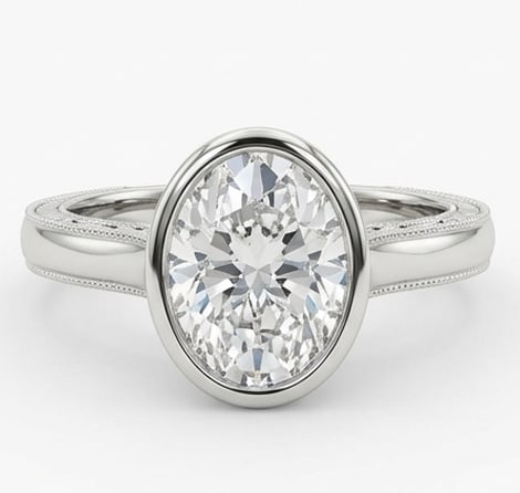 6.00 CT Lab grown diamond Lab-Grown Ring in White Gold: An exceptional 6.00 carat lab-grown lab grown diamond ring, expertly crafted in luxurious White Gold. The oval cut solitaire in a sleek modern bezel setting with fine milgrain edges design highlights