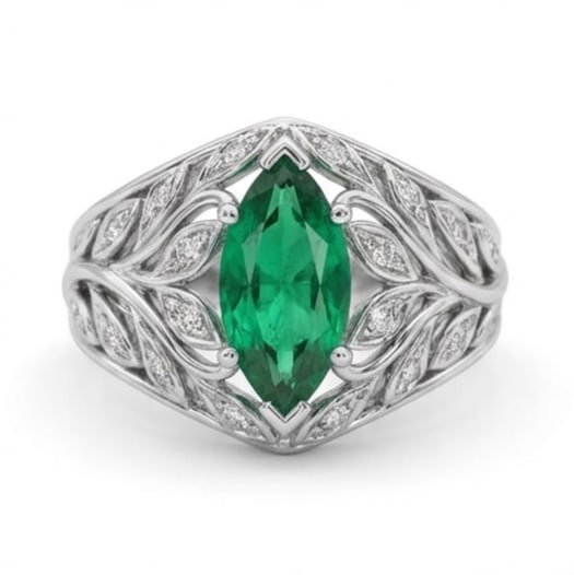 5.00 CT Emerald Lab-Grown Ring in White Gold: An exceptional 5.00 carat lab-grown emerald ring, expertly crafted in luxurious White Gold. The marquise cut green emerald in a vintage leaf/vine split shank setting design highlights the brilliance