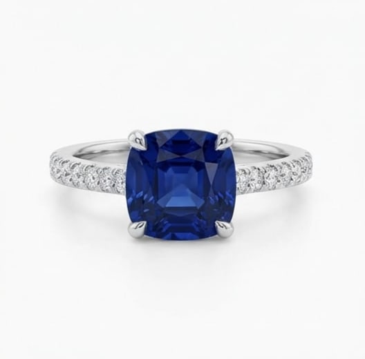 10.00 CT Sapphire Lab-Grown Ring in White Gold: An exceptional 10.00 carat lab-grown sapphire ring, expertly crafted in luxurious White Gold. The cushion cut solitaire with pavé band design highlights the brilliance of the lab-grown center stone,