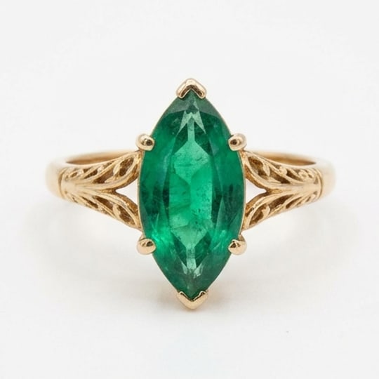 5.00 CT Emerald Lab-Grown Ring in Yellow Gold: An exceptional 5.00 carat lab-grown emerald ring, expertly crafted in luxurious Yellow Gold. The marquise cut vintage solitaire with floral shoulders design highlights the brilliance of the lab-grown