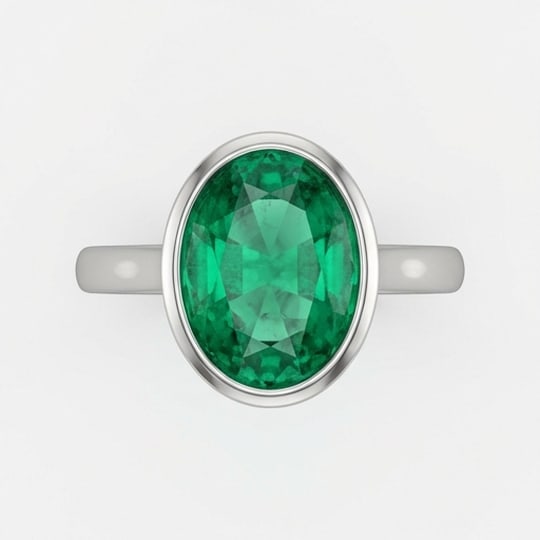 5.00 CT Emerald Lab-Grown Ring in White Gold: An exceptional 5.00 carat lab-grown emerald ring, expertly crafted in luxurious White Gold. The oval cut bezel set solitaire design highlights the brilliance of the lab-grown center stone, accented