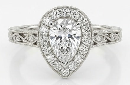 4.00 CT Lab grown diamond Lab-Grown Ring in White Gold: An exceptional 4.00 carat lab-grown lab grown diamond ring, expertly crafted in luxurious White Gold. The pear shape with halo and vintage scroll shoulders design highlights the brilliance of the lab-