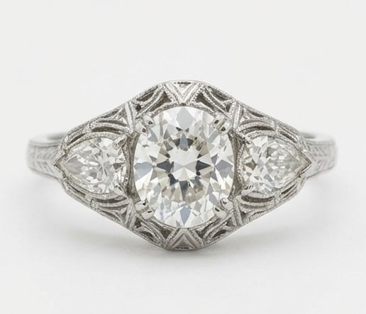 4.00 CT Lab Grown Diamond Lab-Grown Ring in White Gold: An exceptional 4.00 carat lab-grown lab grown diamond ring, expertly crafted in luxurious White Gold. The vintage style three-stone with oval center, pear sides, and engraving design highlights the br