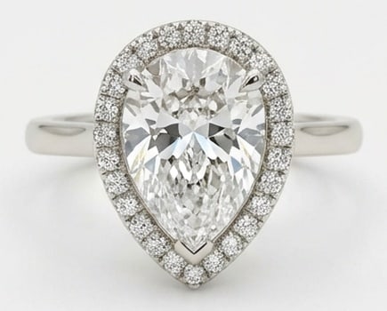 7.00 CT Lab Grown Diamond Lab-Grown Ring in White Gold: An exceptional 7.00 carat lab-grown lab grown diamond ring, expertly crafted in luxurious White Gold. The pear cut with a diamond halo and plain band design highlights the brilliance of the lab-grown