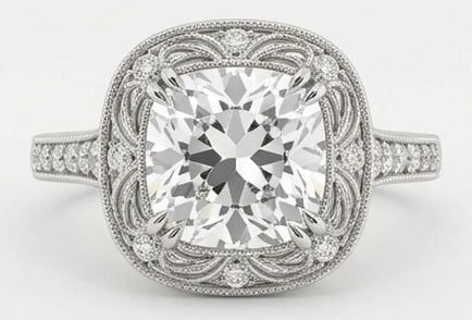 6.00 CT Lab Grown Diamond Lab-Grown Ring in White Gold: An exceptional 6.00 carat lab-grown lab grown diamond ring, expertly crafted in luxurious White Gold. The cushion cut in a vintage halo setting with intricate scrollwork design highlights the brillian