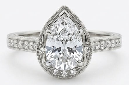 4.00 CT Lab Grown Diamond Lab-Grown Ring in White Gold: An exceptional 4.00 carat lab-grown lab grown diamond ring, expertly crafted in luxurious White Gold. The pear cut in a vintage bezel setting with milgrain and pavé band design highlights the bri