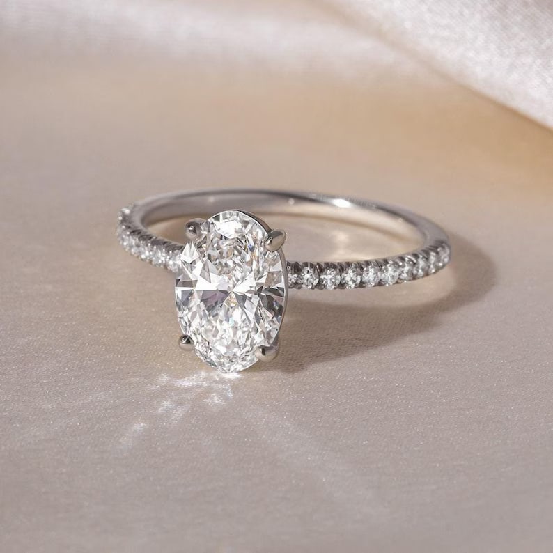 Luxury IGI Certified 2.25 Ct Oval Cut Natural Diamond Ring in 14K White Gold: Elegant luxury engagement ring featuring approximately 2.25 carat natural diamond, beautifully crafted in 14K White Gold. This refined design showcases a breathtaking oval-cut center natural diamond s