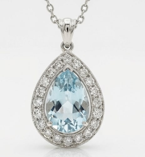 2.5 Ct Pear Natural Aquamarine 14K White Gold Halo Pendant – Certified: This certified fine jewelry piece features a 2.5 carat natural Aquamarine in a Pear cut, crafted in 14K White Gold. The Halo Pendant design highlights the beauty of the natural center stone. It is acc