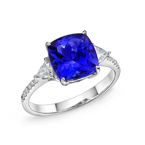4.0 Ct Cushion Natural Tanzanite 14K White Gold Three-Stone Setting Ring – Certified: This certified fine jewelry piece features a 4.0 carat natural Tanzanite in a Cushion cut, crafted in 14K White Gold. The Three-Stone Setting design highlights the beauty of the natural center stone.