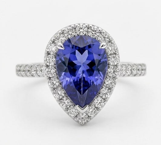 2.5 Ct Pear Natural Tanzanite 14K White Gold Halo Setting with Pave Shank Ring – Certified: This certified fine jewelry piece features a 2.5 carat natural Tanzanite in a Pear cut, crafted in 14K White Gold. The Halo Setting with Pave Shank design highlights the beauty of the natural center s