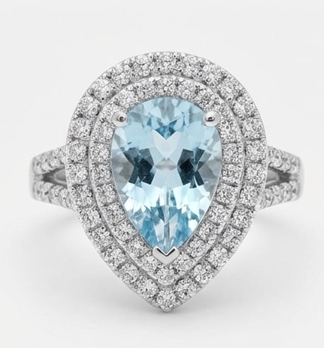 2.5 Ct Pear Natural Aquamarine 14K White Gold Double Halo with Split Shank Ring – Certified: This certified fine jewelry piece features a 2.5 carat natural Aquamarine in a Pear cut, crafted in 14K White Gold. The Double Halo with Split Shank design highlights the beauty of the natural center