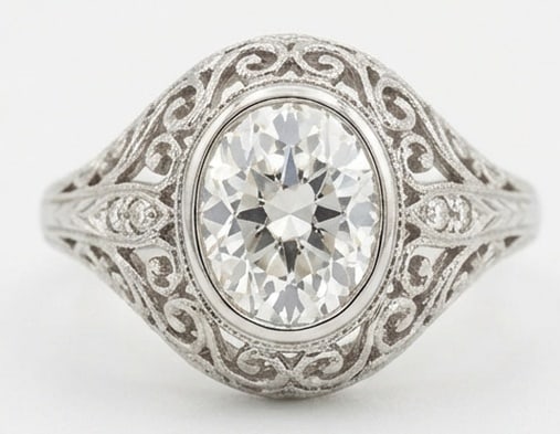 IGI Lab Grown 4.00 Ct Oval Diamond Ring – Art Deco Filigree Wide Band – / in 14K White Gold: Bold yet refined, this design showcases a 4.00 carat IGI Certificate lab grown Oval center diamond. Color E-F Clarity VVS1-VS1 Set in White Gold , the ring is styled with art deco filigree wide band d