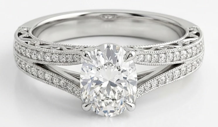 Lab Grown 2.00 Ct Oval Diamond Ring – Vintage Split Shank Pave – / in 14K White Gold: IGI Certified Lab Grown Diamond Center Stone Color E-F Clarity VVS1-VS1 Side Stone Lab Grown DiamondChic and distinctive, this ring showcases a 2.00 carat lab grown Oval center diamond. Set in White G