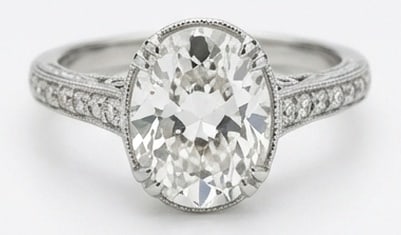 IGI Lab Grown 4.00 Ct Oval Diamond Ring – Vintage Oval Solitaire with Pave Shoulders – / in 14K: IGI Certified Lab Grown Diamond Center Stone Color E-F Clarity VVS1-VS1 Side Stone Lab Grown DiamondStriking and elegant, this ring features a 4.00 carat lab grown Oval center diamond. Featuring the V