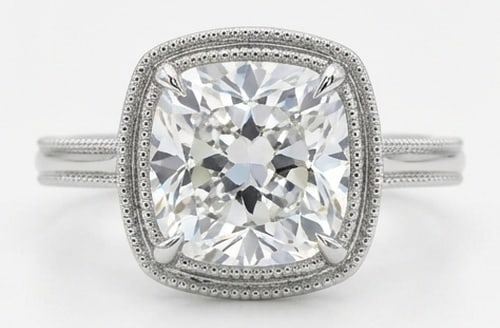 IGI Lab Grown 5.00 Ct Cushion (Old Mine Look) Diamond Ring – Cushion Halo with Milgrain Bezel &: IGI Certified Lab Grown Diamond Center Stone Color E-F Clarity VVS1-VS1 Sophisticated and modern, this ring is defined by a 5.00 carat lab grown Cushion (Old Mine Look) center diamond. Featuring the C