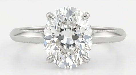 IGI Lab Grown 4.00 Ct Oval Diamond Ring – Classic Knife-Edge Oval Solitaire – / in 14K White: IGI Certified Lab Grown Diamond Center Stone Color E-F Clarity VVS1-VS1 Chic and distinctive, this ring showcases a 4.00 carat lab grown Oval center diamond. White Gold gives the piece a refined, neut