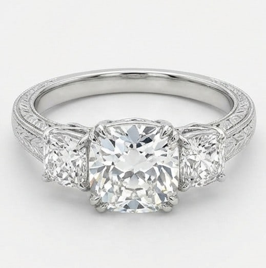 IGI Lab Grown 4.00 Ct Cushion (Old Mine Look) Diamond Ring Vintage Three-Stone Cushion with Milgrain: IGI Certified Lab Grown Diamond Center Stone Color E-F Clarity VVS1-VS1 Side Stone Lab Grown Diamond A timeless statement, this ring highlights a 4.00 carat lab grown Cushion (Old Mine Look) center di