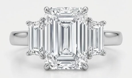 IGI Lab Grown 8.00 Ct Emerald Cut Diamond Ring – Classic Three-Stone Emerald with Trapezoid Sides: IGI Certified Lab Grown Diamond Center Stone Color E-F Clarity VVS1-VS1 Side Stone Lab Grown Diamond Classic with a contemporary edge, this ring spotlights a 8.00 carat lab grown Emerald Cut center di