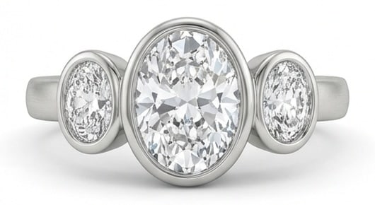 IGI Lab Grown 3.00 Ct Oval Diamond Ring – Modern Bezel Set Three-Stone Oval – / in 14K White: IGI Certified Lab Grown Diamond Center Stone Color E-F Clarity VVS1-VS1 Side Stone Lab Grown Diamond Sophisticated and modern, this ring is defined by a 3.00 carat lab grown Oval center diamond. Featu