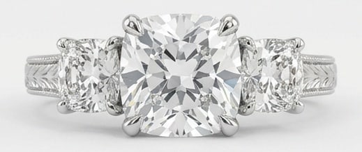 IGI Lab Grown 4.00 Ct Cushion (Old Mine Look) Diamond Ring Vintage Three-Stone Cushion with Engraved: IGI Certified Lab Grown Diamond Center Stone Color E-F Clarity VVS1-VS1 Side Stone Lab Grown Diamond Bold yet refined, this design showcases a 4.00 carat lab grown Cushion (Old Mine Look) center diamo
