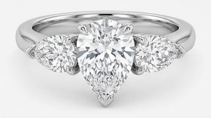 IGI Lab Grown 3.00 Ct Pear Shape Diamond Ring – Classic Three-Stone Pear with Pear Sides – / in: IGI Certified Lab Grown Diamond Center Stone Color E-F Clarity VVS1-VS1 Side Stone Lab Grown Diamond Beautifully styled, this ring is anchored by a 3.00 carat lab grown Pear Shape center diamond as th