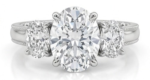 IGI Lab Grown 5.00 Ct Oval Diamond Ring Three-stone setting with milgrain detail on shank shoulders: IGI Certified Lab Grown Diamond Center Stone Color E-F Clarity VVS1-VS1 Side Stone Lab Grown Diamond Striking and elegant, this ring features a 5.00 carat lab grown Oval center diamond. Featuring the