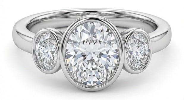 IGI Lab Grown 3.00 Ct Oval Diamond Ring Modern full bezel-set three-stone with smooth polished band: Chic and distinctive, this ring showcases a 3.00 carat lab grown Oval center diamond. Set in White Gold, the ring is styled with modern full bezel-set three-stone with smooth polished band details tha