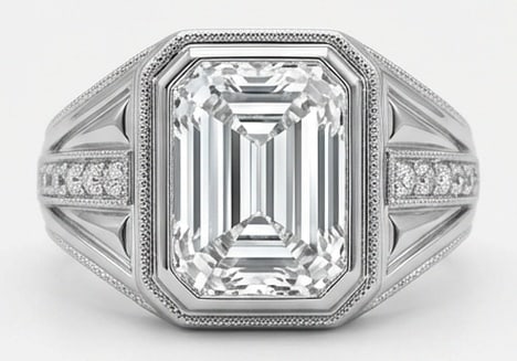 IGI Lab Grown 6.00 Ct Emerald Diamond Ring – Art Deco architectural setting with bezel center and: IGI Certified Lab Grown Diamond Center Stone Color E-F Clarity VVS1-VS1 Side Stone Lab Grown Diamond Designed to stand out, this ring presents a 6.00 carat lab grown Emerald center diamond. Set in Whi