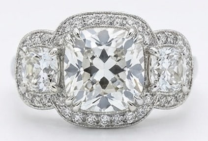 Lab Grown 6.00 Ct Cushion Diamond Ring – Triple halo setting (center and sides) with pave band and: Sophisticated and modern, this ring is defined by a 6.00 carat lab grown Cushion center diamond. Featuring the Triple halo setting (center and sides) with pave band and milgrain theme, offering a dist