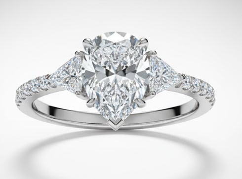 Luxury IGI Certified 1.50 Ct Pear Cut Lab Grown Diamond Ring in 14K White Gold: An elegant and luxurious engagement ring featuring an approximately 1.50 carat lab grown diamond in a refined pear cut cut. Beautifully crafted in premium 14K White Gold, this ring showcases a three-s