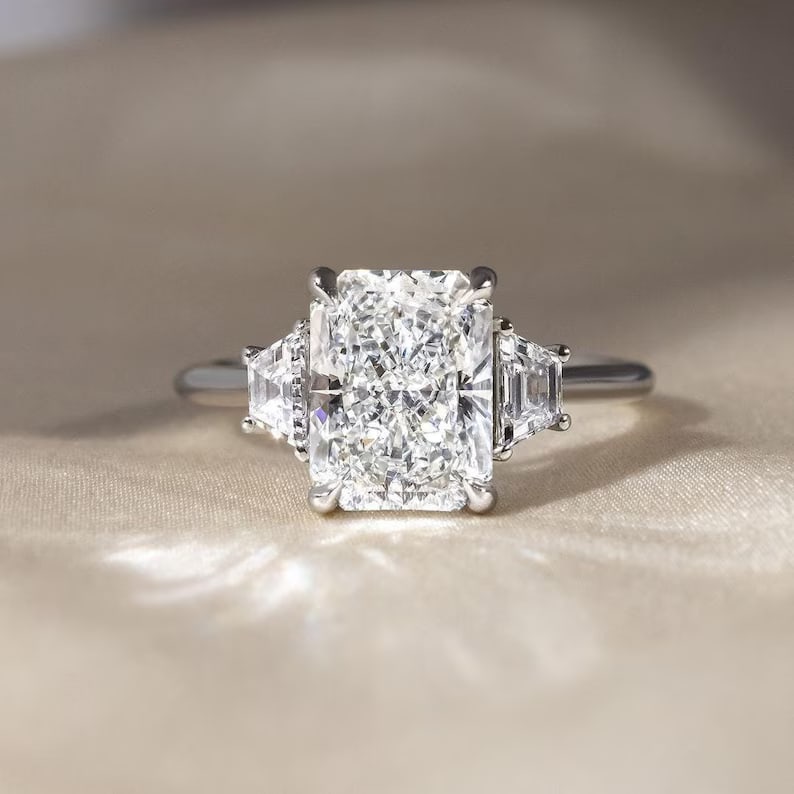 Luxury IGI Certified 2.20 Ct Radiant Cut Lab Grown Diamond Ring in 14K White Gold: An elegant and luxurious engagement ring featuring an approximately 2.20 carat lab grown diamond in a refined radiant cut cut. Beautifully crafted in premium 14K White Gold, this ring showcases a thre