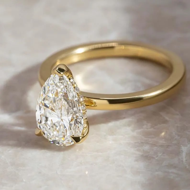 Luxury GIA Certified 1.70 Ct Pear Cut Lab Grown Diamond Ring in 14K Yellow Gold: An elegant and luxurious engagement ring featuring an approximately 1.70 carat lab grown diamond in a refined pear cut cut. Beautifully crafted in premium 14K Yellow Gold, this ring showcases a solita
