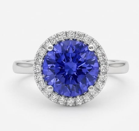 3.0 Ct Round Natural Tanzanite 14K White Gold Halo Setting with Plain Shank Ring Certified: This certified fine jewelry piece features a 3.0 carat natural Tanzanite in a Round cut, crafted in 14K White Gold. The Halo Setting with Plain Shank design highlights the beauty of the natural center