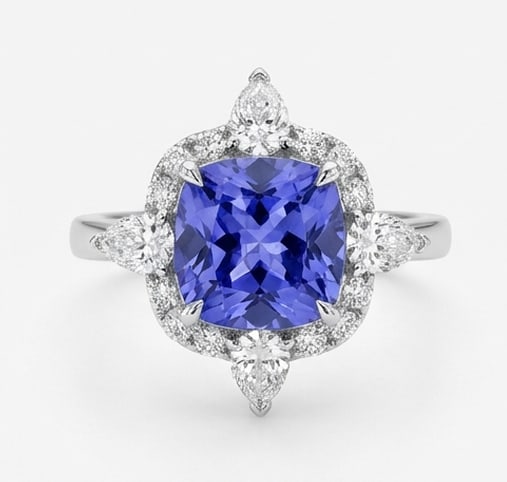 2.5 Ct Cushion Natural Tanzanite 14K White Gold Starburst / Floral Halo Ring Certified: This certified fine jewelry piece features a 2.5 carat natural Tanzanite in a Cushion cut, crafted in 14K White Gold. The Starburst / Floral Halo design highlights the beauty of the natural center sto