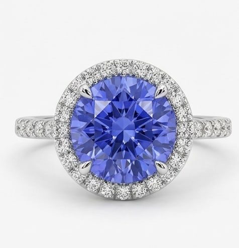 3.0 Ct Round Natural Tanzanite 14K White Gold Halo Setting with Pave Shank Ring Certified: This certified fine jewelry piece features a 3.0 carat natural Tanzanite in a Round cut, crafted in 14K White Gold. The Halo Setting with Pave Shank design highlights the beauty of the natural center 
