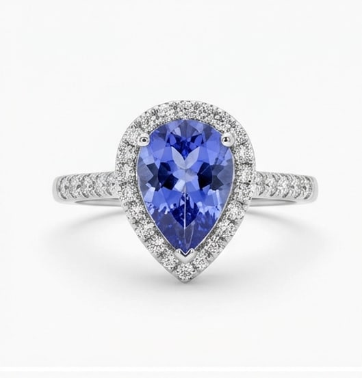3.0 Ct Pear Natural Tanzanite 14K White Gold Halo Setting with Pave Shank Ring Certified: This certified fine jewelry piece features a 3.0 carat natural Tanzanite in a Pear cut, crafted in 14K White Gold. The Halo Setting with Pave Shank design highlights the beauty of the natural center s