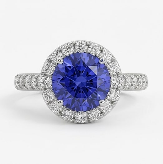 2.5 Ct Round Natural Tanzanite 14K White Gold Halo Setting with Pave Shank Ring Certified: This certified fine jewelry piece features a 2.5 carat natural Tanzanite in a Round cut, crafted in 14K White Gold. The Halo Setting with Pave Shank design highlights the beauty of the natural center 