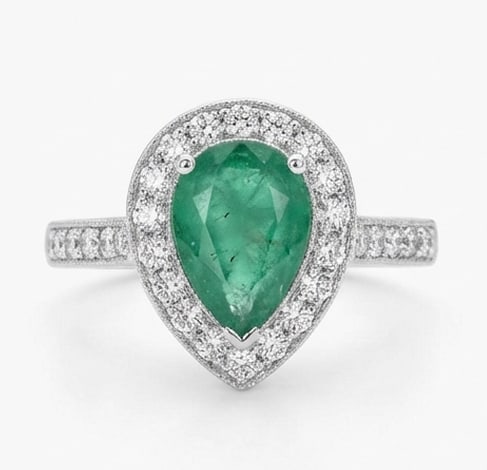 2.0 Ct Pear Natural Emerald 14K White Gold Halo Setting with Pave Shank Ring Certified: This certified fine jewelry piece features a 2.0 carat natural Emerald in a Pear cut, crafted in 14K White Gold. The Halo Setting with Pave Shank design highlights the beauty of the natural center sto