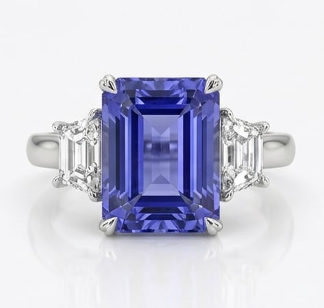 4.0 Ct Emerald Natural Tanzanite 14K White Gold Three-Stone Setting Ring Certified: This certified fine jewelry piece features a 4.0 carat natural Tanzanite in a Emerald cut, crafted in 14K White Gold. The Three-Stone Setting design highlights the beauty of the natural center stone. 