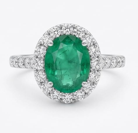 2.0 Ct Oval Natural Emerald 14K White Gold Halo Setting with Pave Shank Ring Certified: This certified fine jewelry piece features a 2.0 carat natural Emerald in a Oval cut, crafted in 14K White Gold. The Halo Setting with Pave Shank design highlights the beauty of the natural center sto