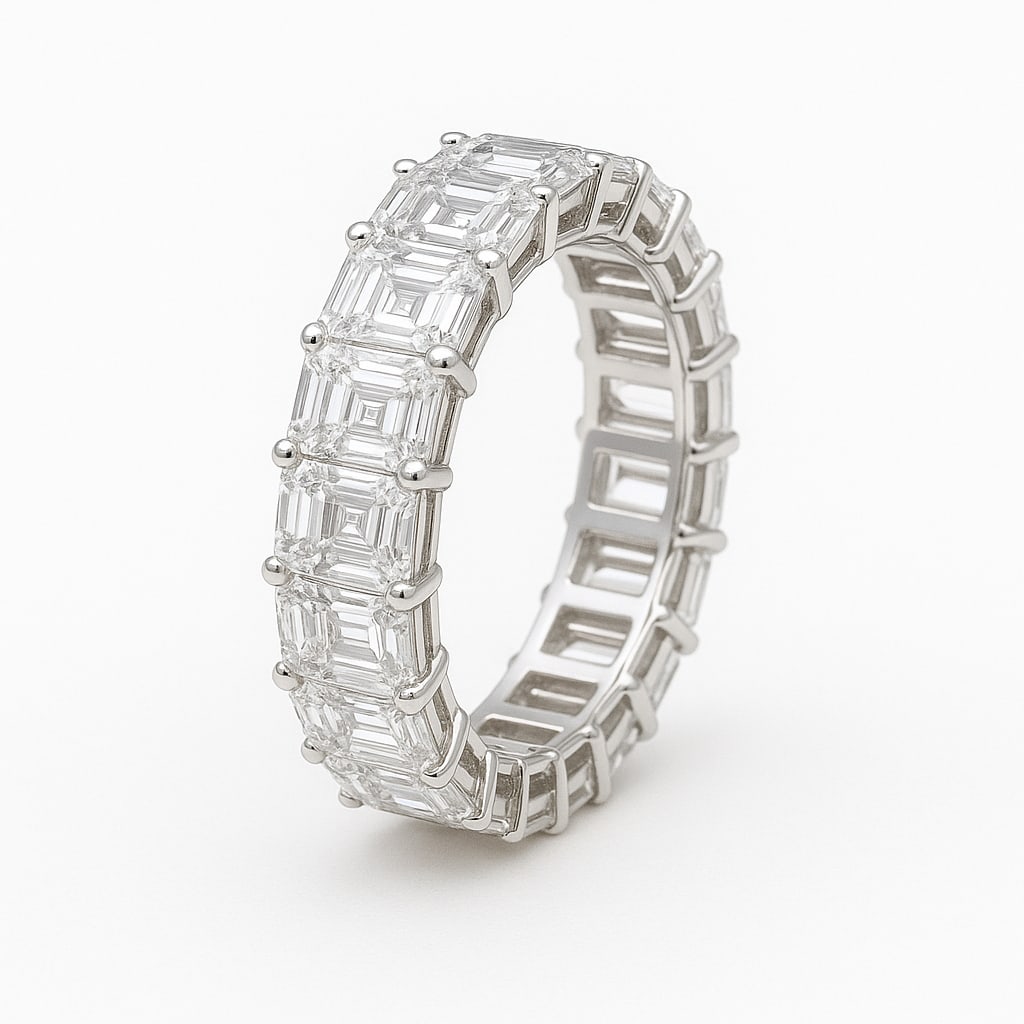 4 Ct Emerald Cut Certified Lab Grown Diamond Eternity Band in 14K White Gold: A sophisticated 4 carat certified lab grown diamond eternity band crafted in luxurious 14K white gold. This elegant design features a continuous row of beautifully matched emerald cut diamonds set aro