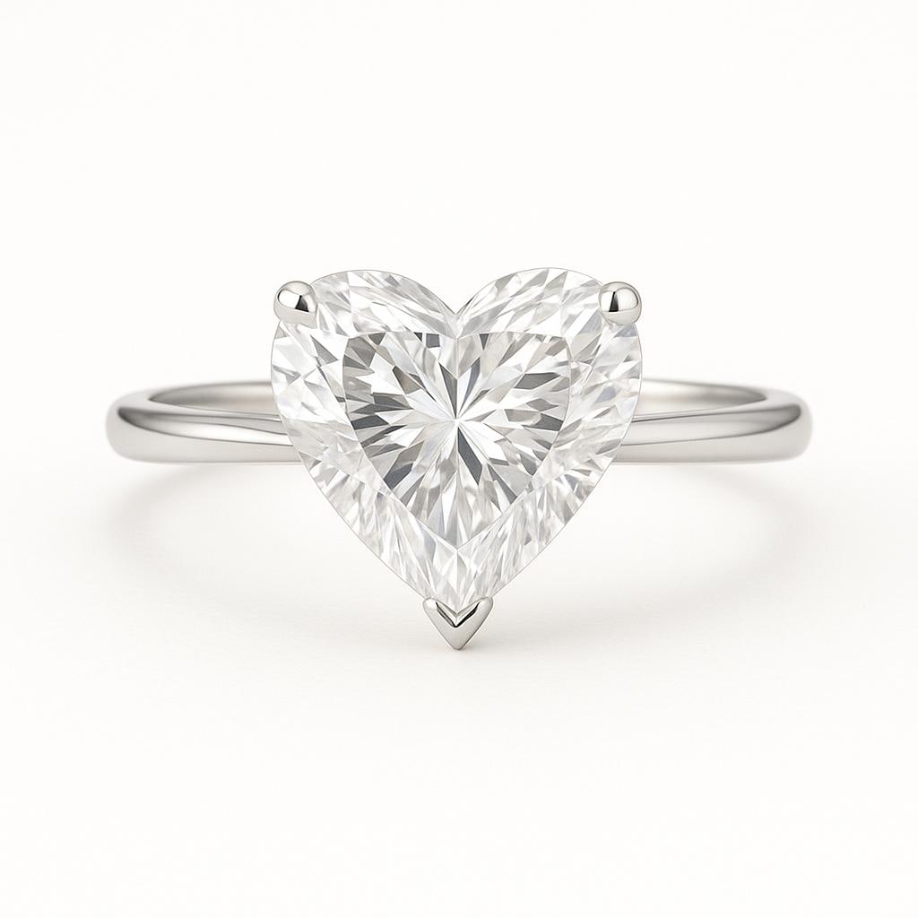 5 CT Lab Grown Heart Cut Diamond Solitaire Ring in 14K White Gold: Romantic 5 carat lab grown heart cut diamond solitaire, set in a secure prong setting. Crafted in 14K white gold with a polished band, this timeless design radiates love and brilliance. Color Grade: E