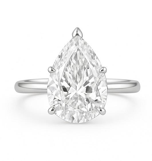 10 CT Lab Grown Pear Cut Diamond Solitaire Ring in 14K White Gold: Magnificent 10 carat lab grown pear cut diamond solitaire, set in a secure prong mounting. Crafted in 14K white gold with a sleek high-polish band, designed for maximum brilliance and timeless sophist