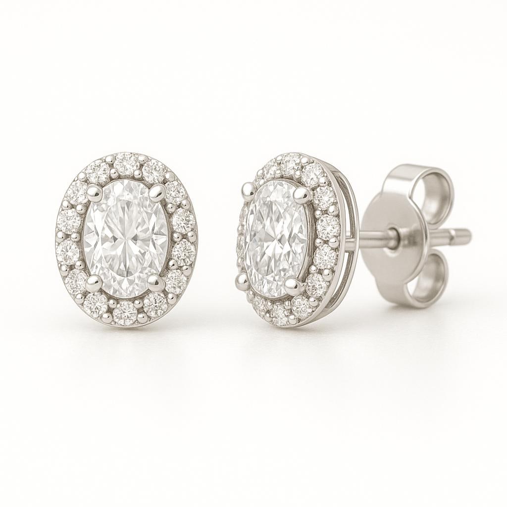 4 CT Lab Grown Oval Cut Diamond Halo Stud Earrings in 14K White Gold: Elegant 4 carat total weight lab grown oval cut diamond studs, each surrounded by a halo of sparkling lab grown round diamonds. Set in 14K white gold with secure push-back closures, these earrings off