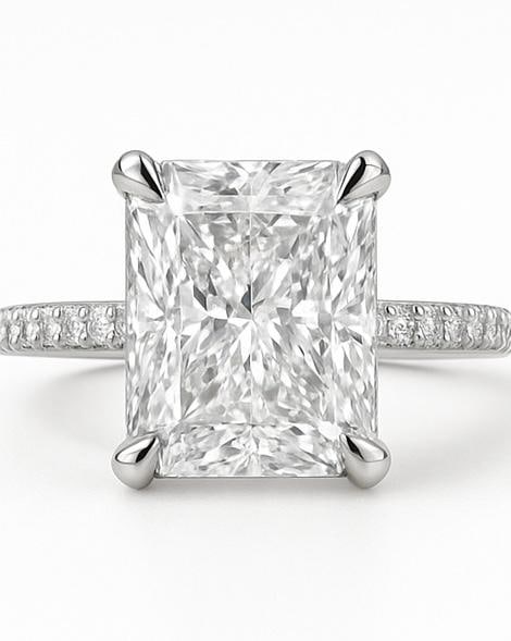 10 CT Lab Grown Radiant Cut Diamond Solitaire Ring with Pavé Band in 14K White Gold: Magnificent 10 carat lab grown radiant cut diamond solitaire, mounted in a secure prong setting. The pavé-set diamond band enhances the brilliance, crafted in 14K white gold with a sleek high-polish 