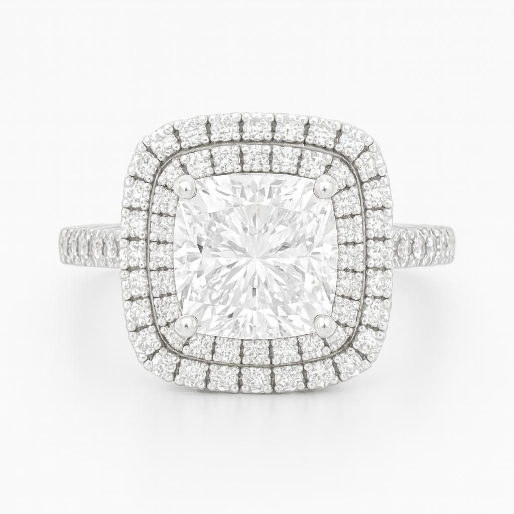 5.50 CT Lab Grown Cushion Cut Diamond Double Halo Ring with Pavé Band in 14K White Gold: Brilliant 5.50 carat lab grown cushion cut diamond centerpiece, framed by a double halo of sparkling lab grown round diamonds. The pavé-set diamond band enhances overall brilliance, all crafted in 14